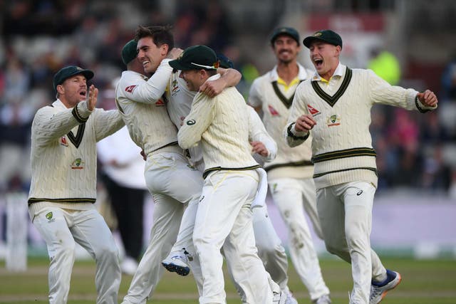 Australia celebrate taking the late wicket of Joe Root