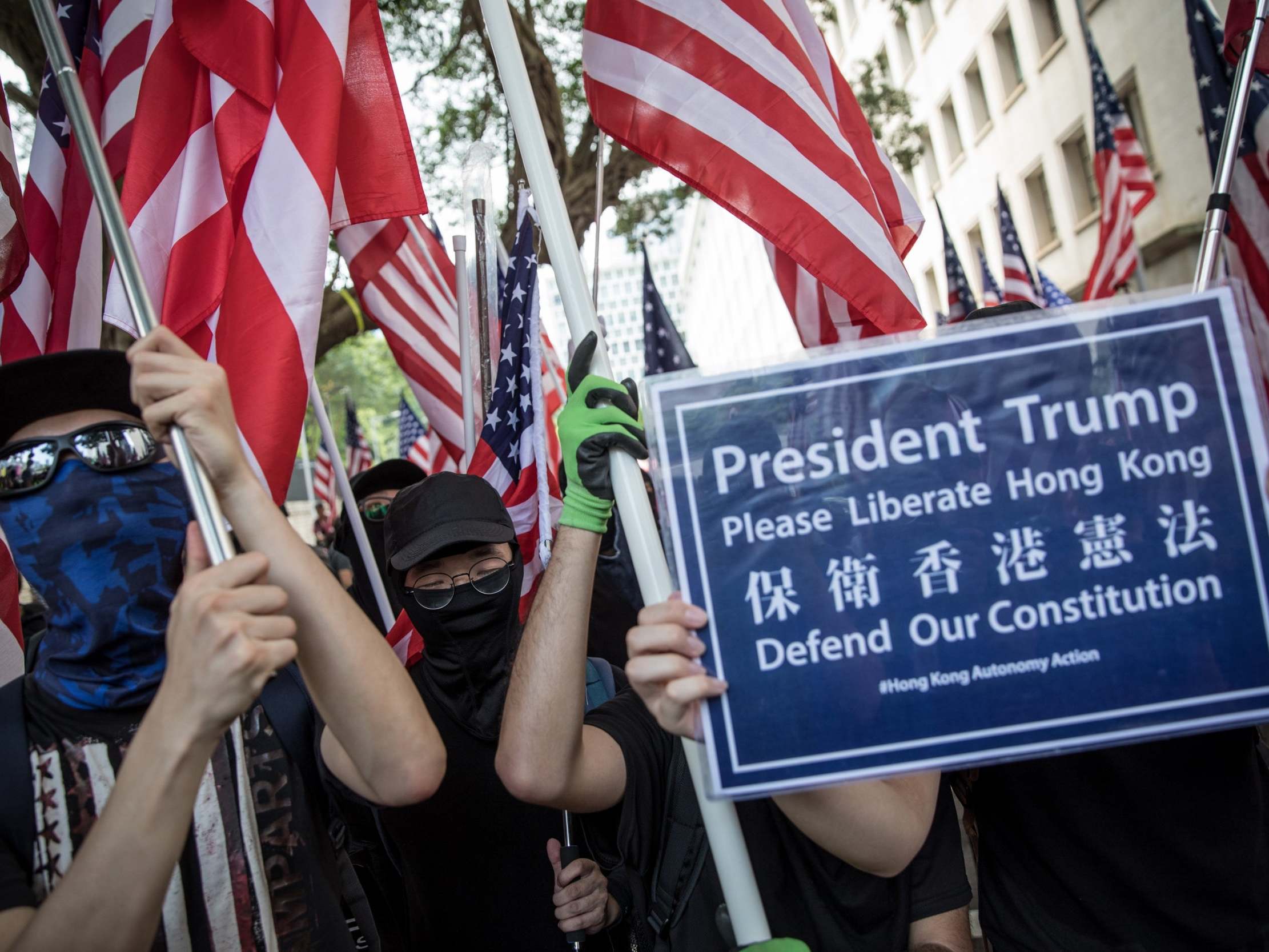 Hong Kong protesters, waving American flags, call on Trump to ‘liberate