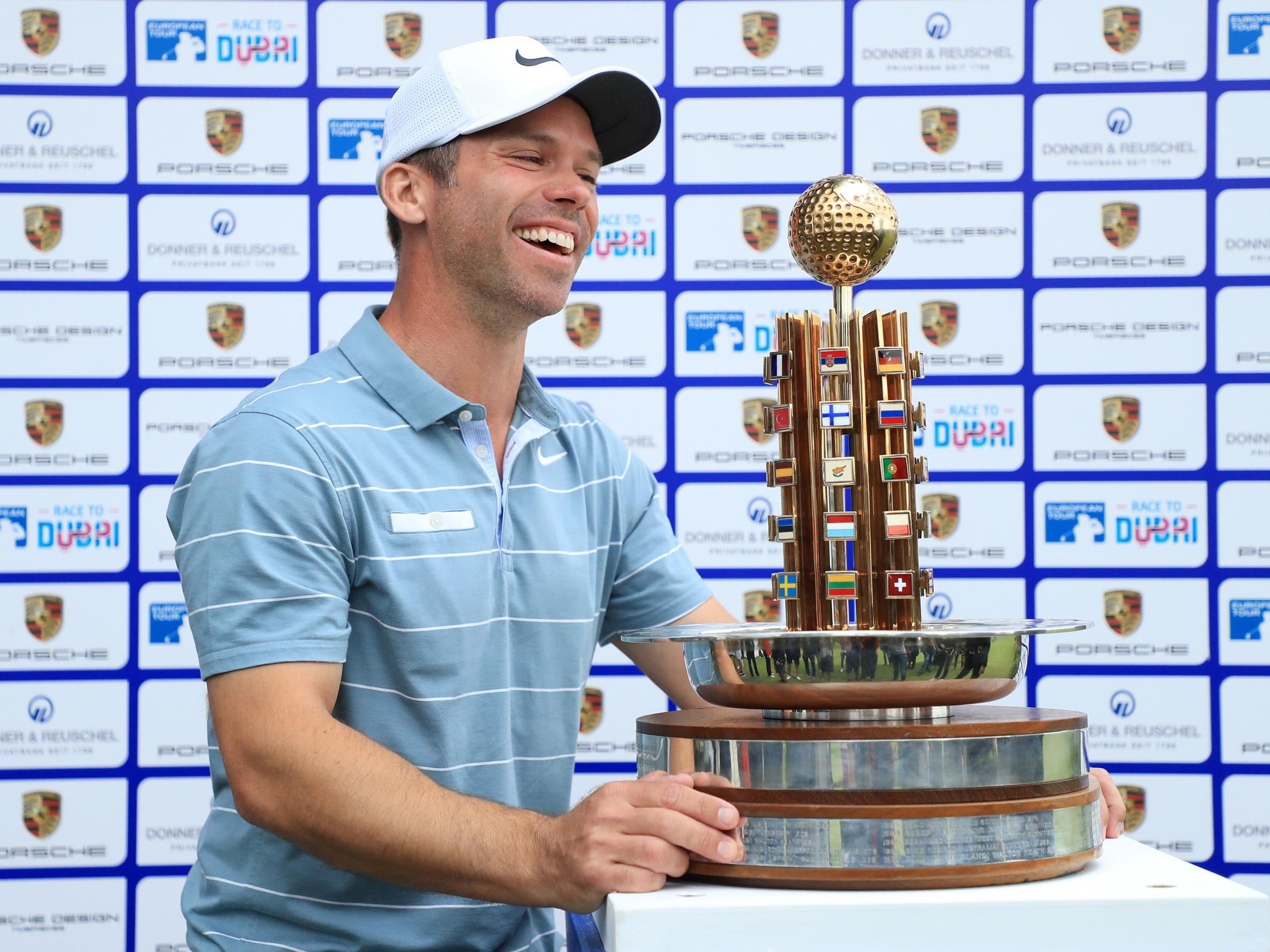 Paul Casey celebrates with the trophy after victory at the Green Eagle Golf Course