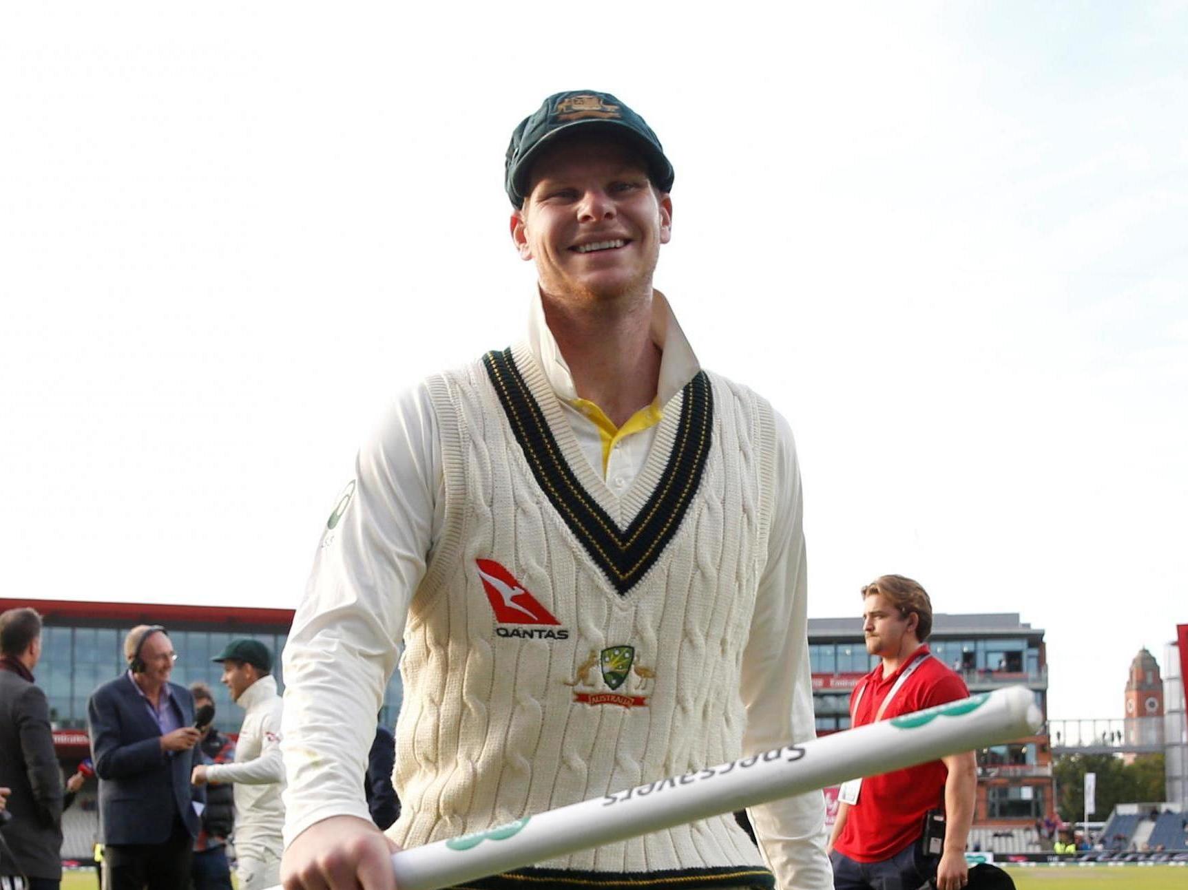 Steve Smith celebrates at Old Trafford after Australia retain the Ashes