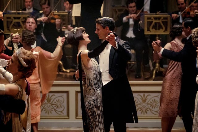 Michelle Dockery as Lady Mary Talbot, centre left, and Matthew Goode as Henry Talbot in a scene from the film