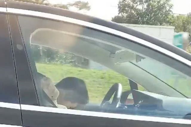 Still image taken from video appearing to show a driver asleep at the wheel of a Tesla car in Boston, Massachusetts, 8 September 2019.