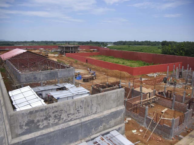 Labourers work at the centre's construction site in Assam