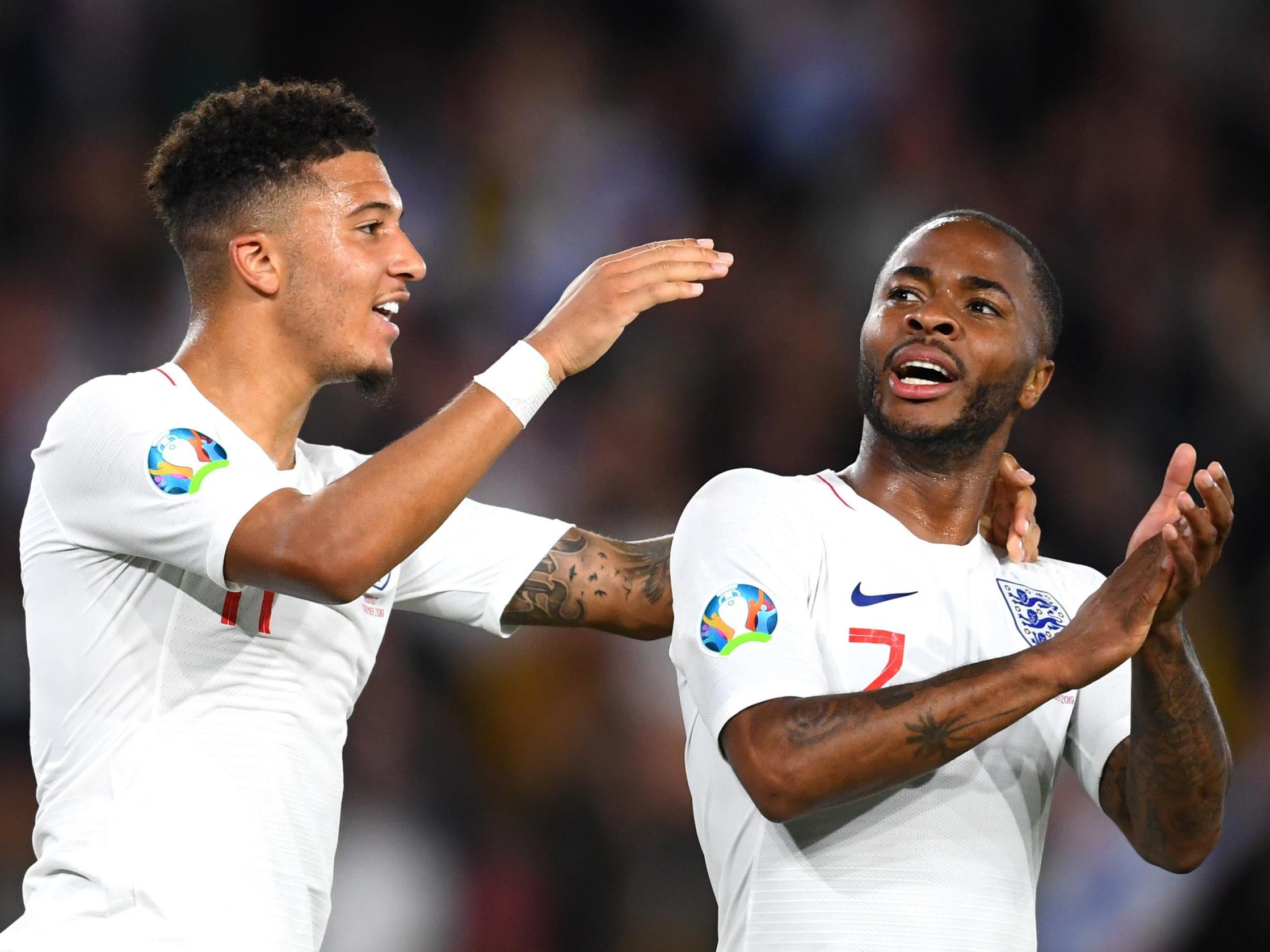 Jadon Sancho and Raheem Sterling celebrate