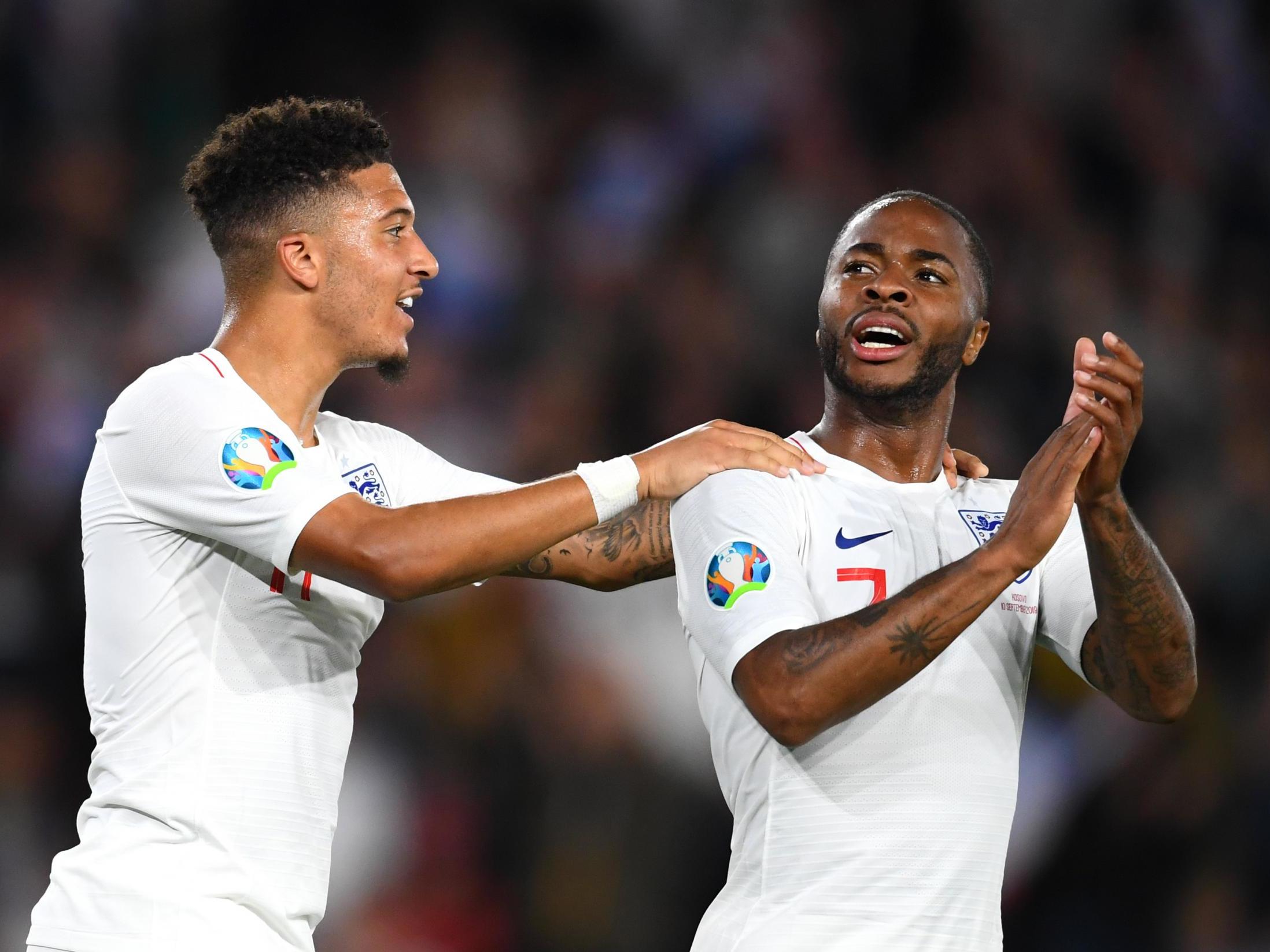 Jadon Sancho and Raheem Sterling celebrate