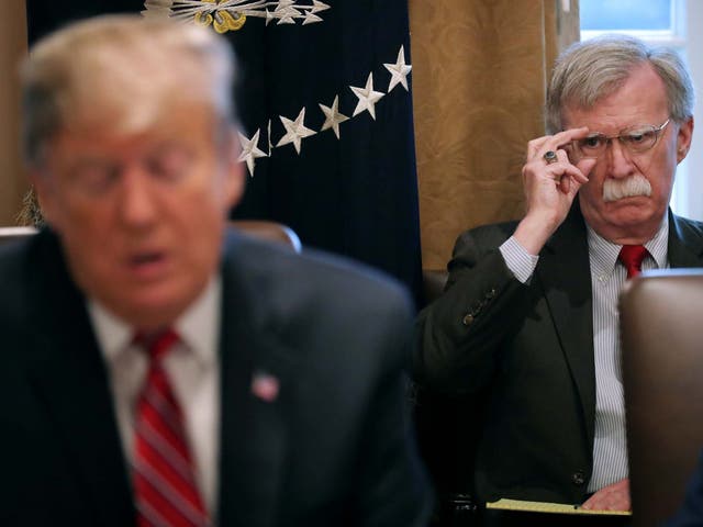 Donald Trump and outgoing national security adviser John Bolton in the Cabinet Room at the White House