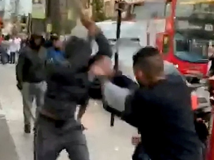 Baseball bat-wielding men brawl in broad daylight on London street