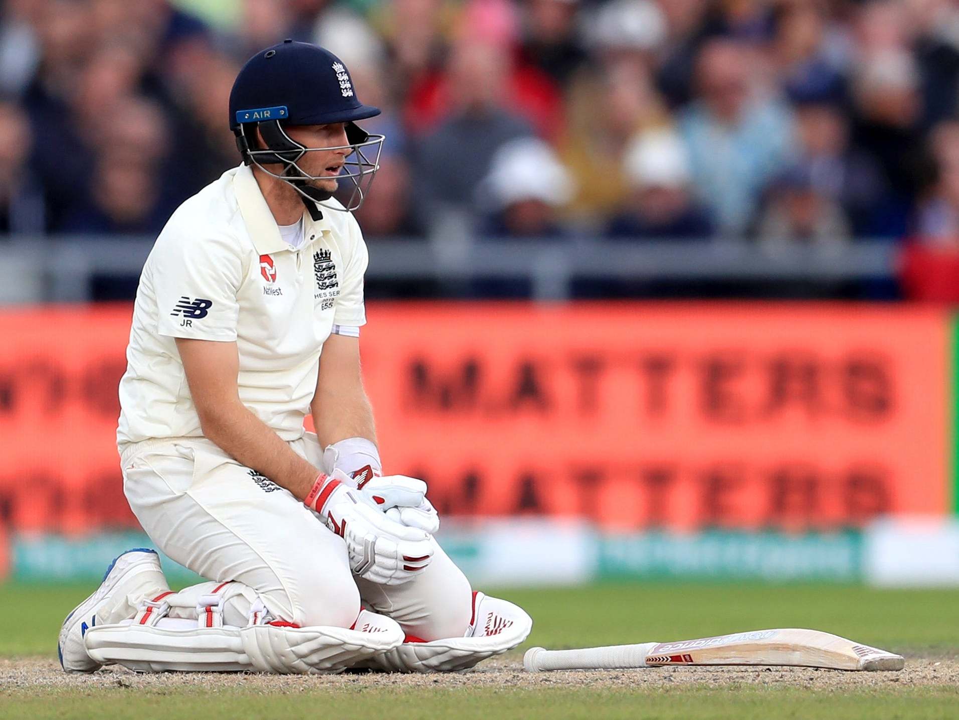 England's Joe Root goes down after being struck by the ball during day three of the fourth Ashes Test at Emirates Old Trafford on 6 September 2019