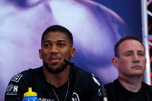 Anthony Joshua and trainer Rob McCracken during the press conference