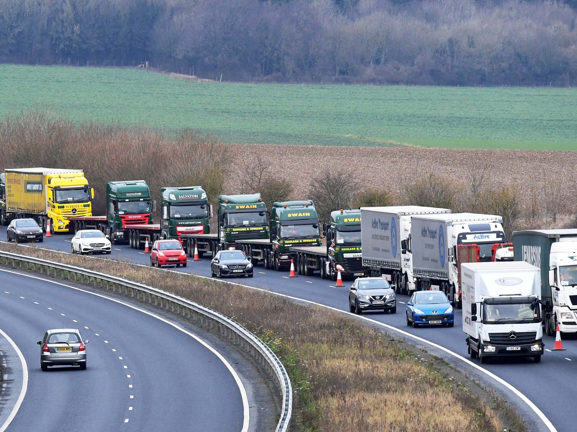 Trucks take part in a government exercise to prepare for expected queues at Channel ports after Brexit