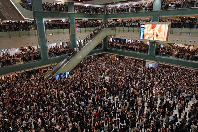Hong Kong citizens sing protest karaoke at a city shopping mall