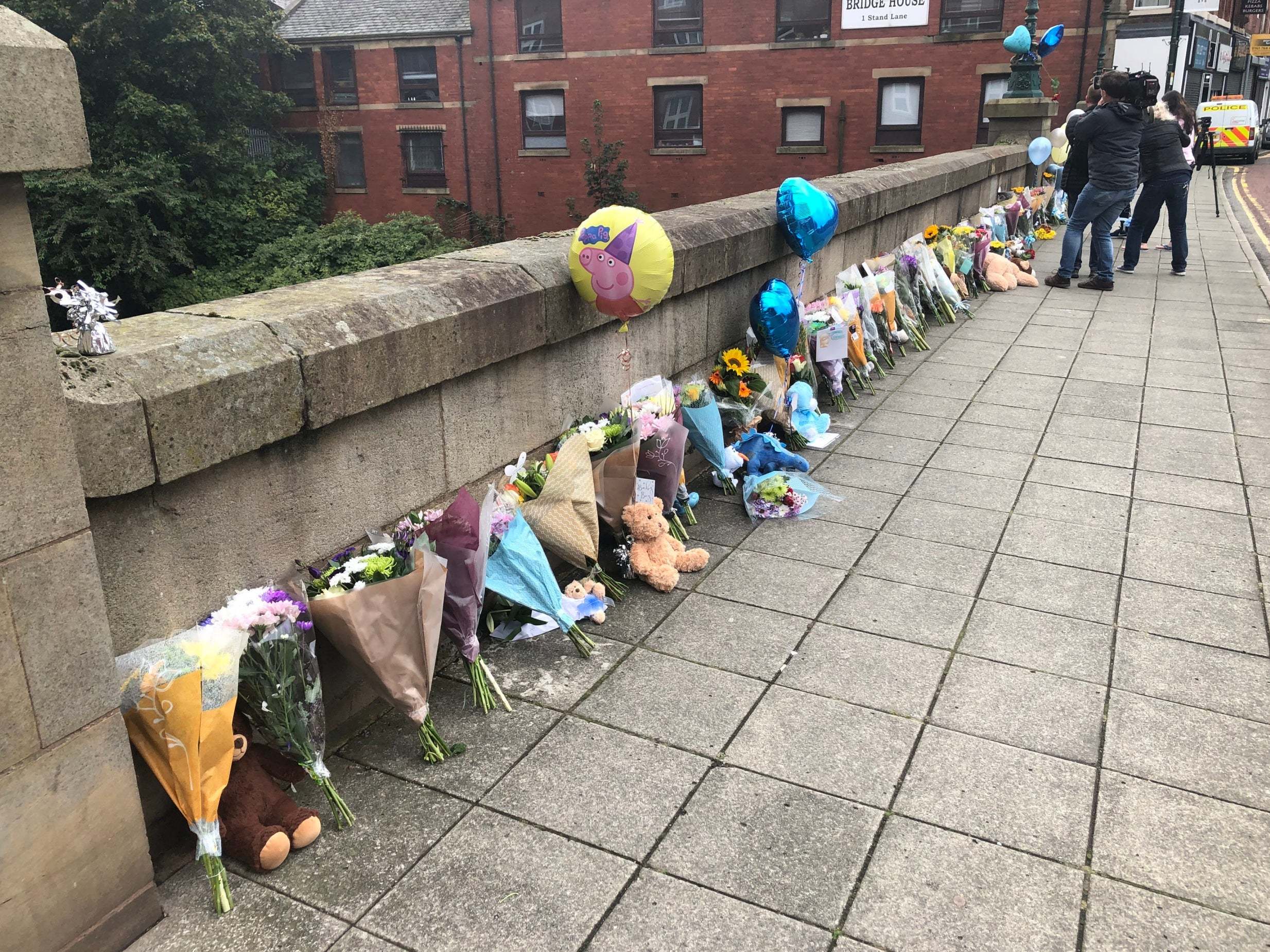 Flowers left on a bridge over the River Irwell in Radcliffe following the death of the baby boy