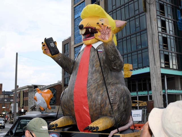 The inflatable depicting Donald Trump as a rat was paraded ahead of the president's visit to Baltimore.