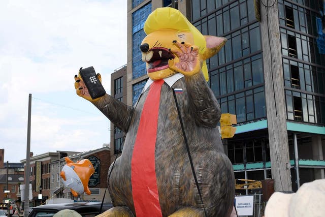 The inflatable depicting Donald Trump as a rat was paraded ahead of the president's visit to Baltimore.