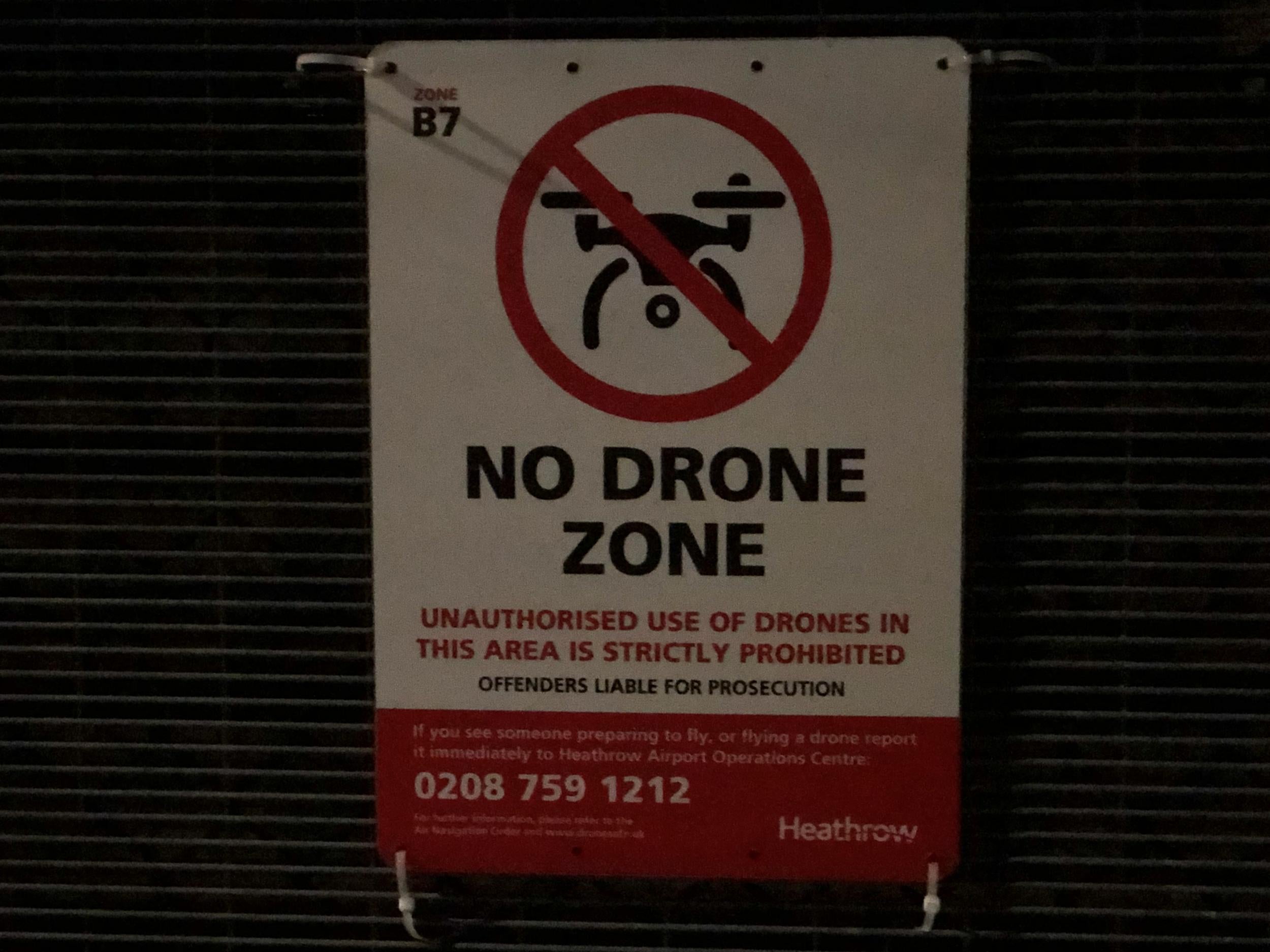 No-fly zone: a warning on the perimeter fence at Heathrow