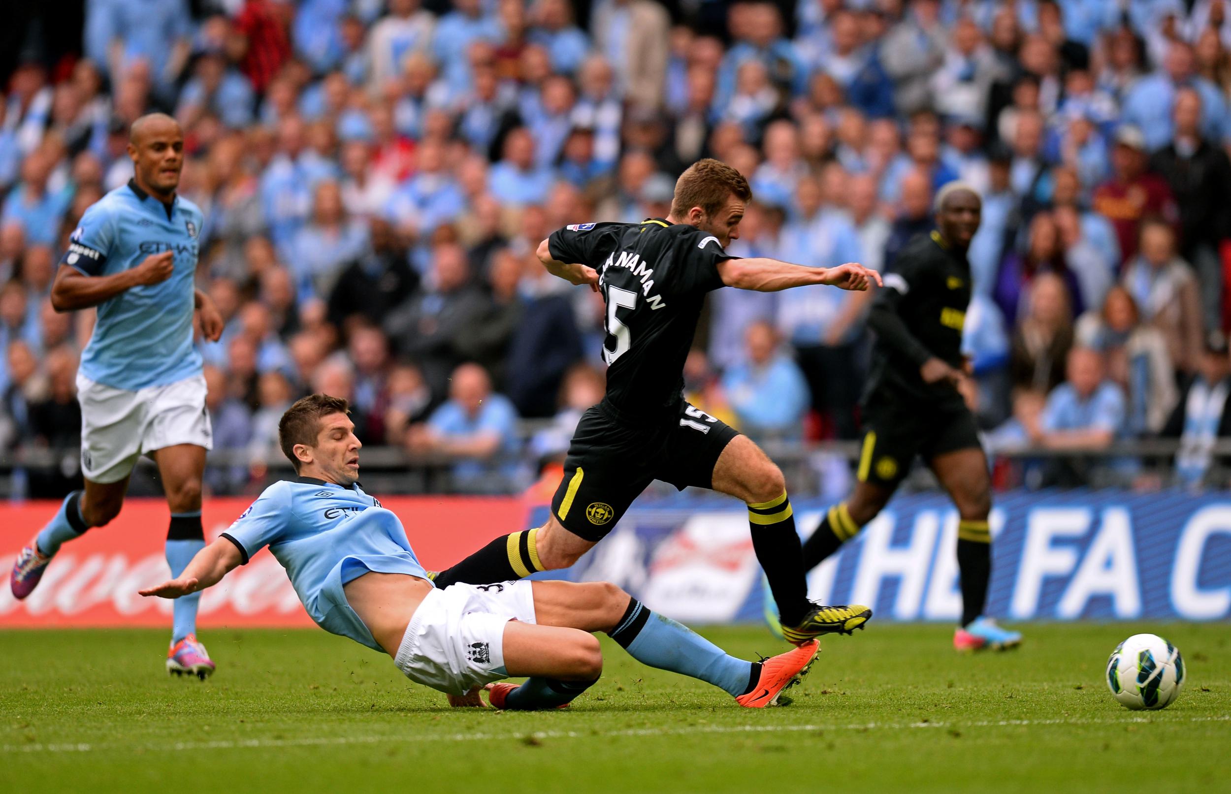 McManaman runs at the Manchester City defence during the FA Cup final