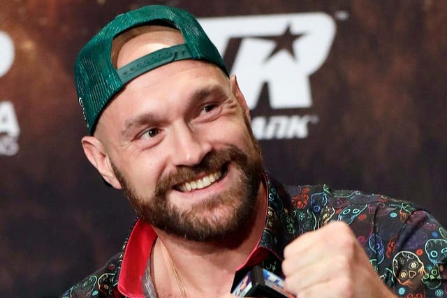 Tyson Fury speaks during a news conference