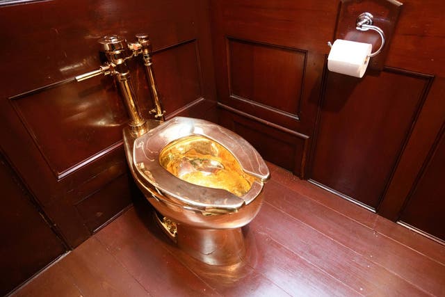 The solid gold toilet, which was fulling working, was created by Italian artist Maurizio Cattelan