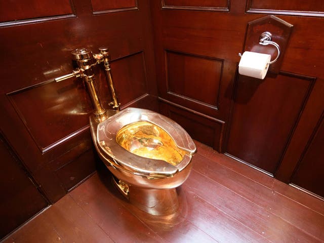 The solid gold toilet, which was fulling working, was created by Italian artist Maurizio Cattelan