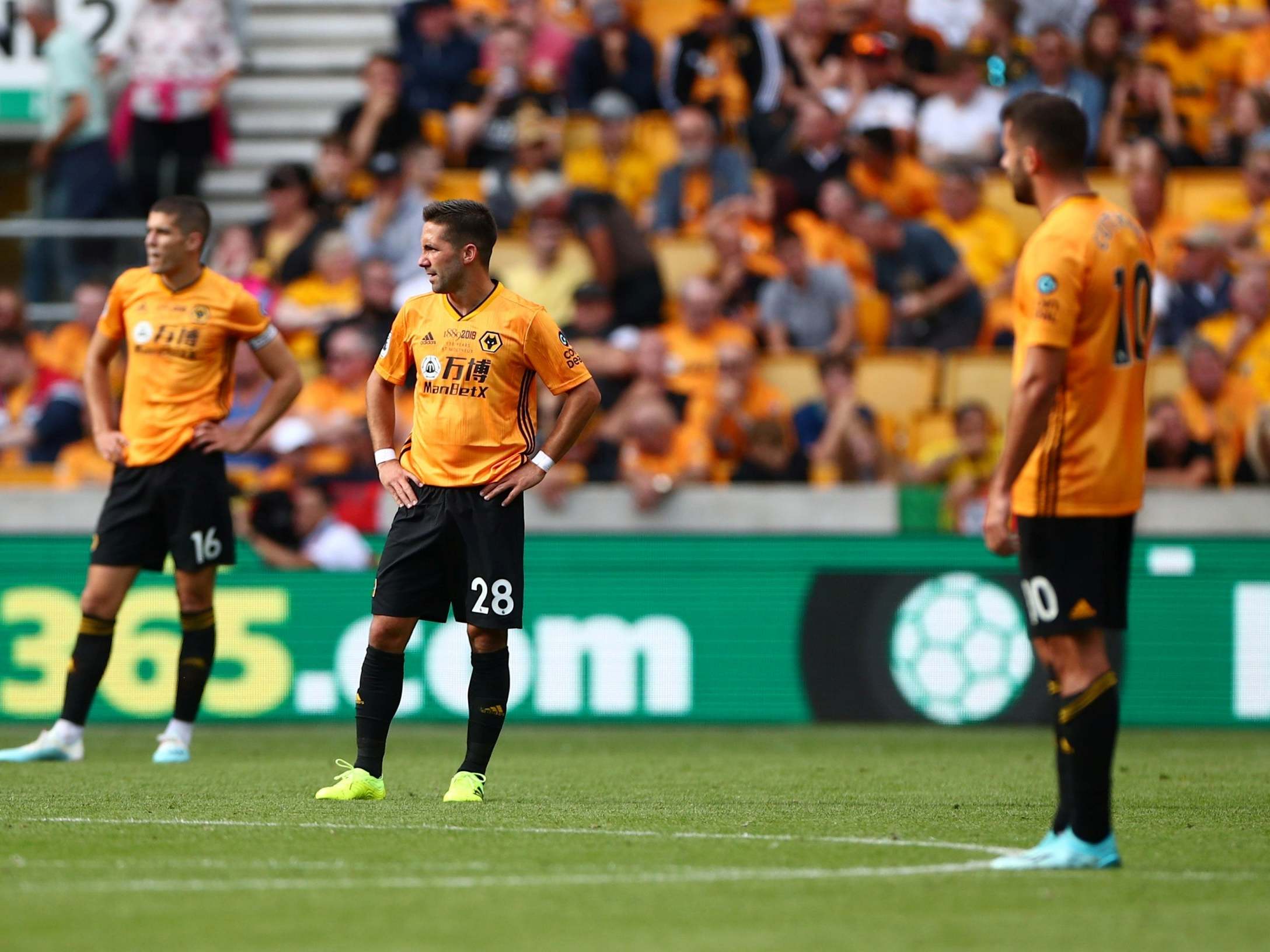 Wolves’ players look on after Chelsea’s fourth goal of the afternoon