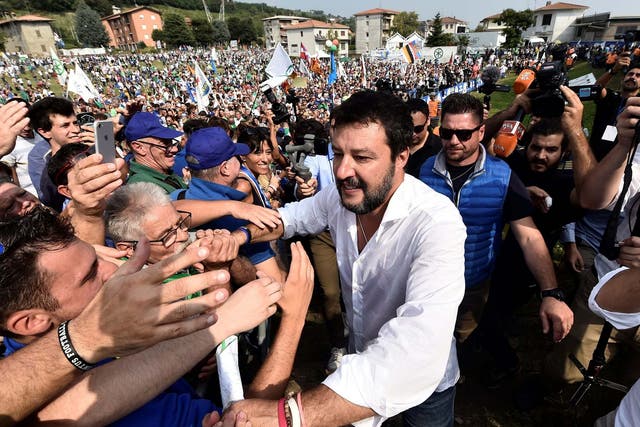 League party leader Matteo Salvini greets supporters during a packed rally in Pontida, Italy on 15 September