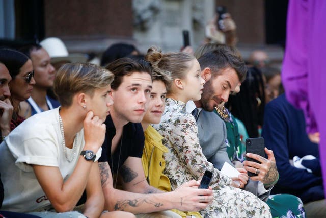 David Beckham and his children Brooklyn, Romeo, Cruz and Harper were seated front row in support of their mum