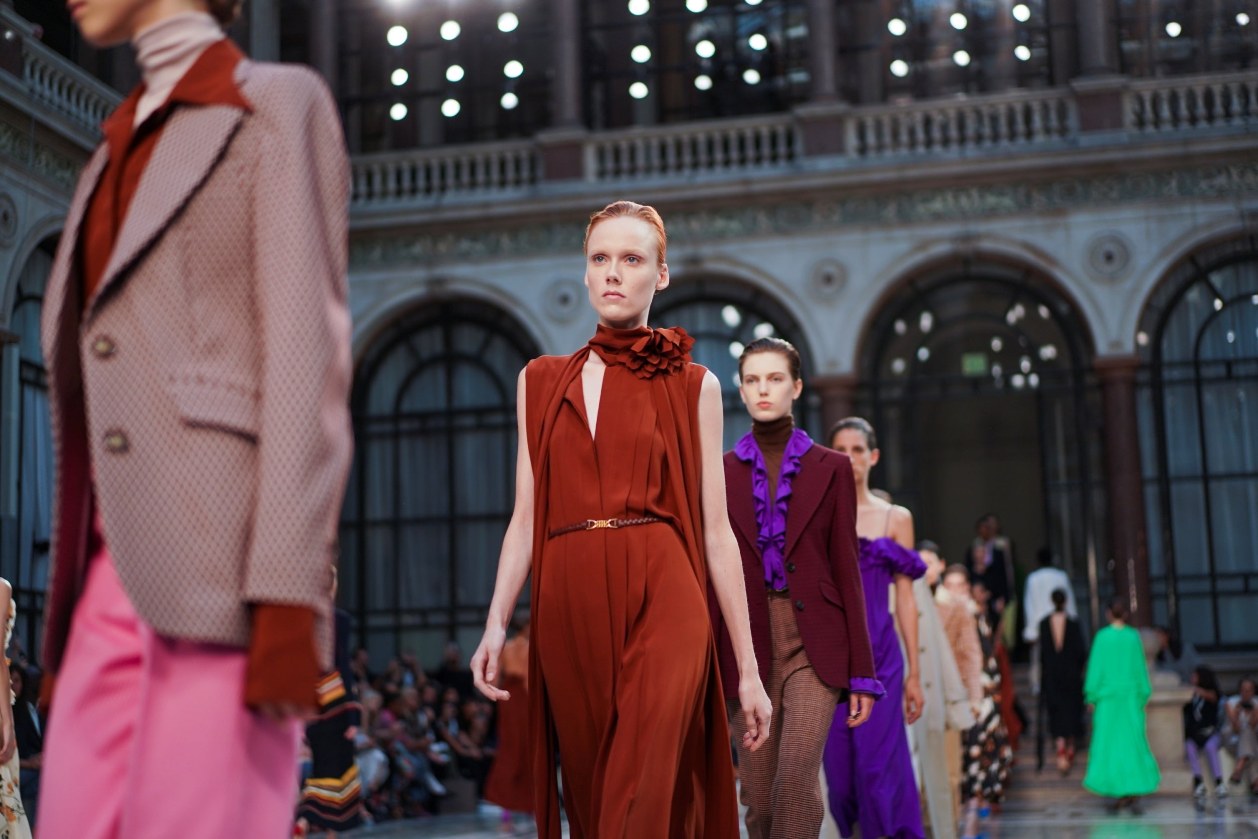 Models walk down the runway in Beckham’s creations, in rich autumnal tones (Reuters)