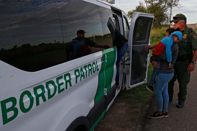 US Border Patrol agents apprehend families suspected of crossing the Rio Grande River to enter the United States illegally on 11 September 2019.