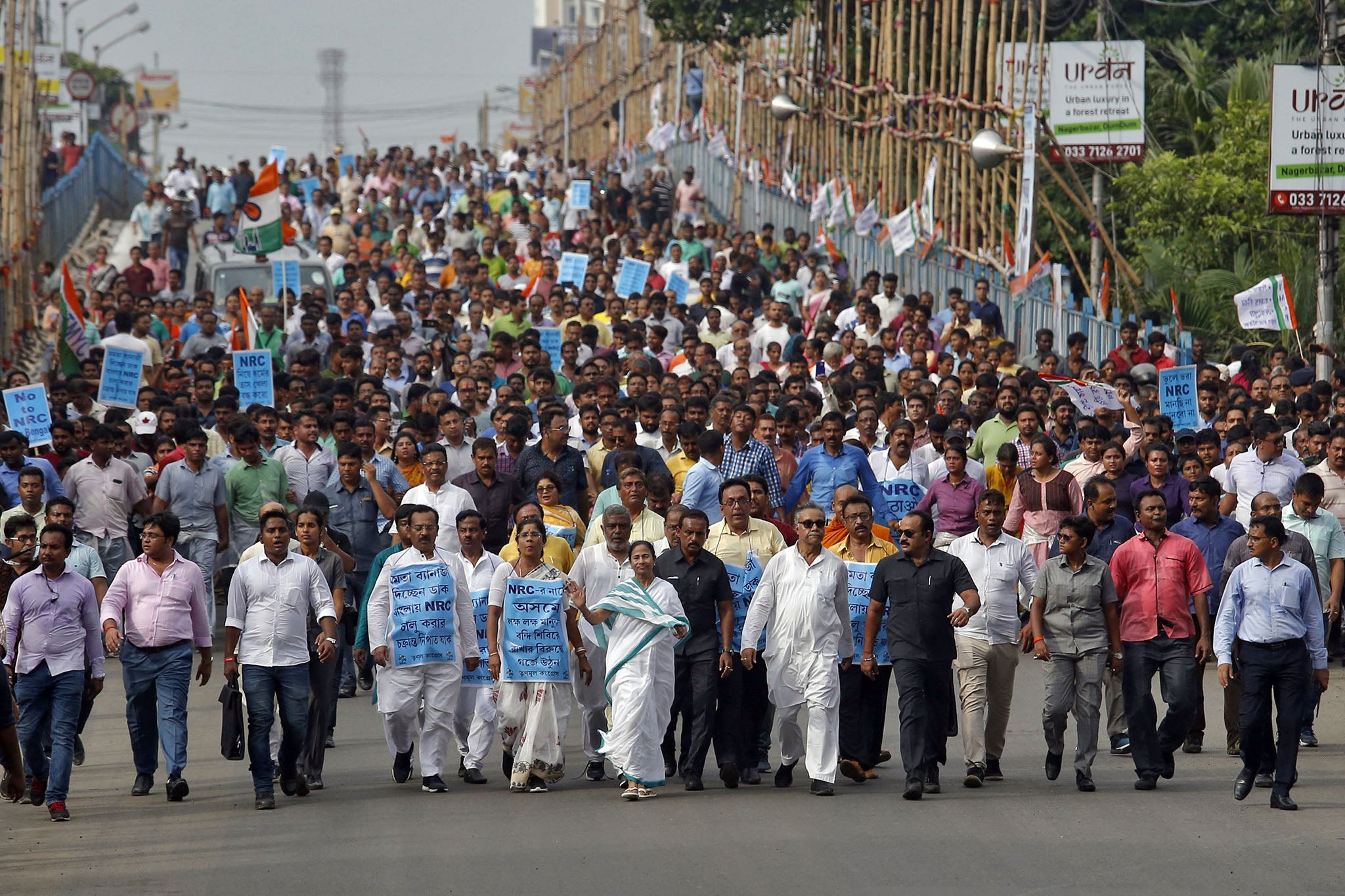 Mamata Banerjee (centre in green sari), chief minister of West Bengal, attends a protest march against the final draft of the NRC