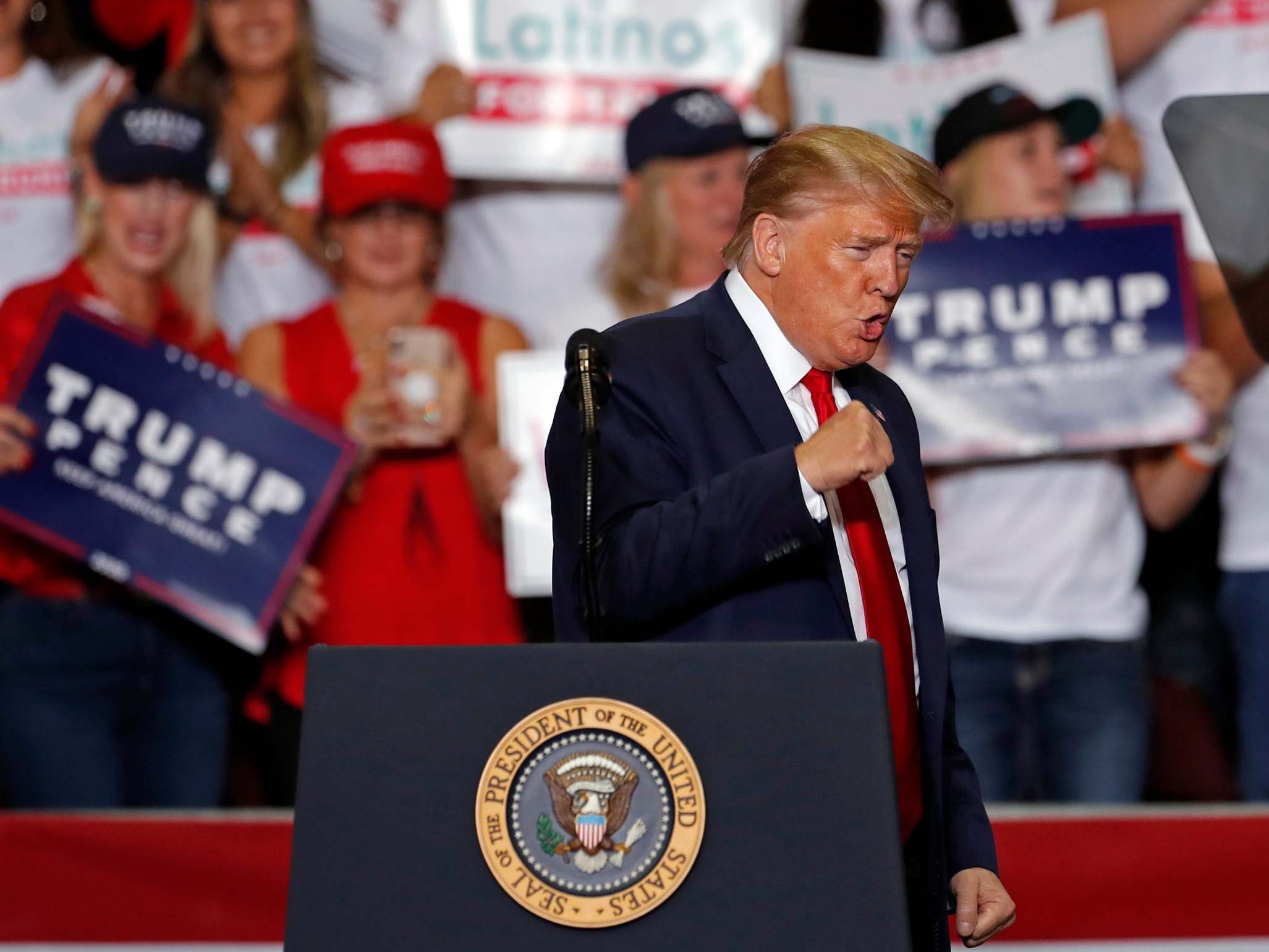 Trump news – live: President&apos;s rambling rally speech disturbed by flies and hecklers, as poll shows him losing series of swing states