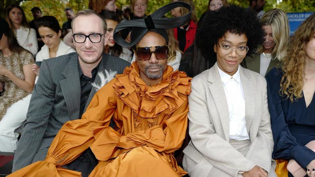 Billy Porter was quite literally the darling of London Fashion Week this season, making several front row appearances over the course of the event, attending each in a different ensemble. For Roksanda, he arrived in a spectacularly ruffly orange gown and a giant black bow on his head. Meanwhile, Ackie channeled a sophisticated librarian look in a loose-fitting taupe suit.