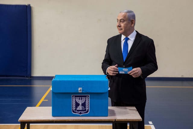 Netanyahu casts his ballot at a polling station in Jerusalem