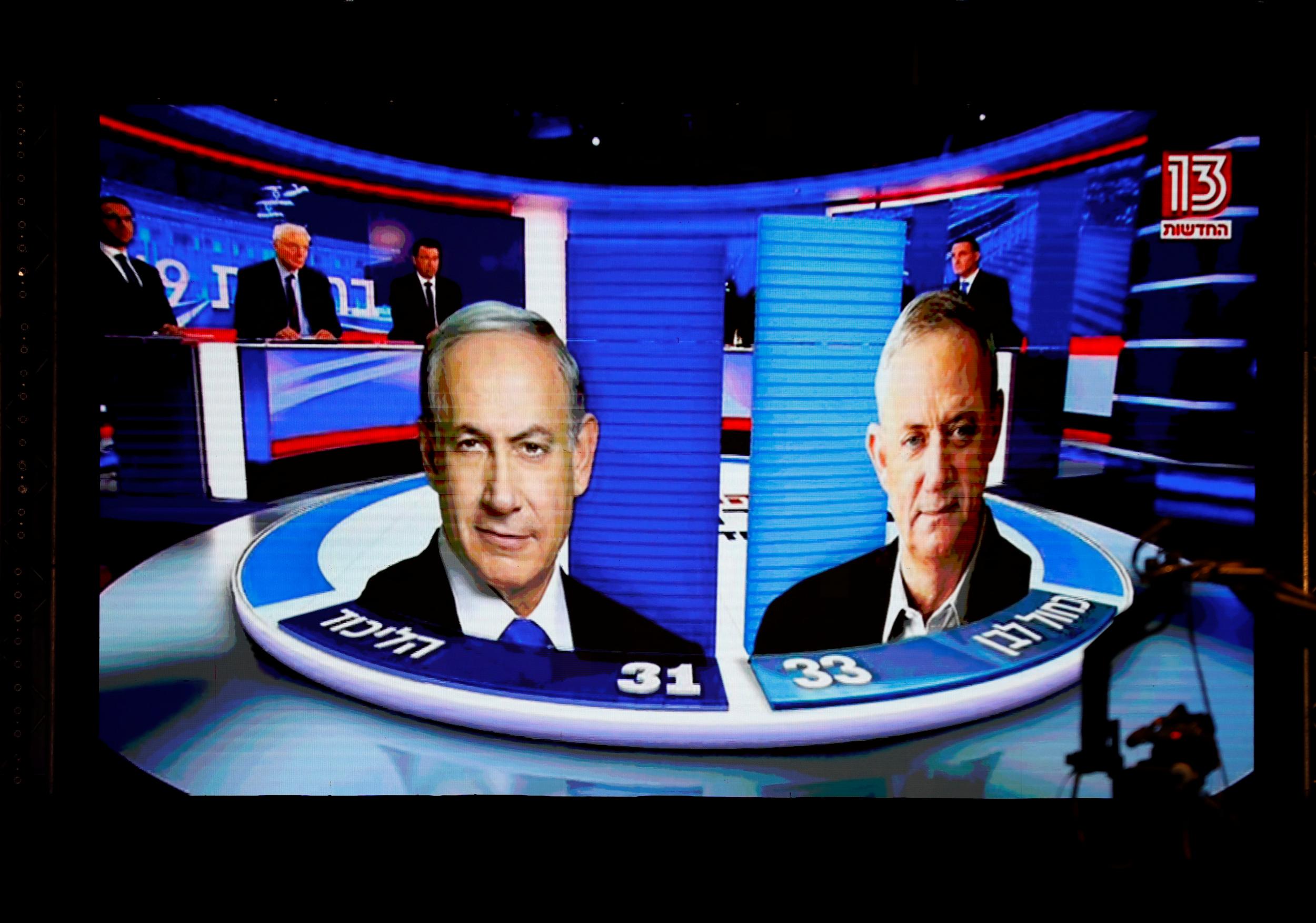 The results of the exit polls seen at Benny Gantz’s Blue and White party headquarters (Reuters/Amir Cohen)