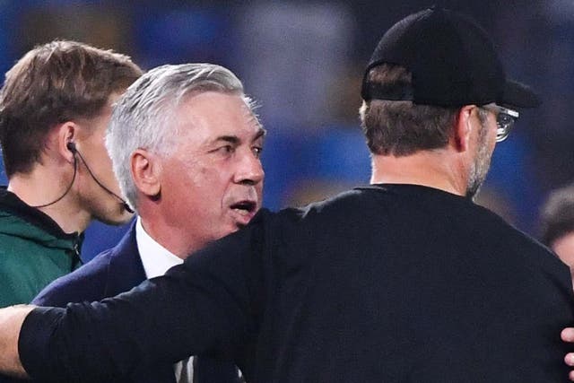 Ancelotti and Klopp embrace at the San Paolo