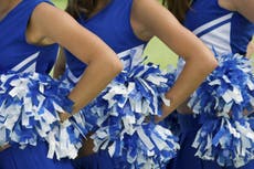 Cheerleaders placed on probation after posing with Trump 2020 sign 