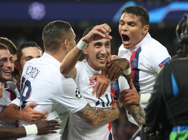 Ángel Di María is mobbed after scoring