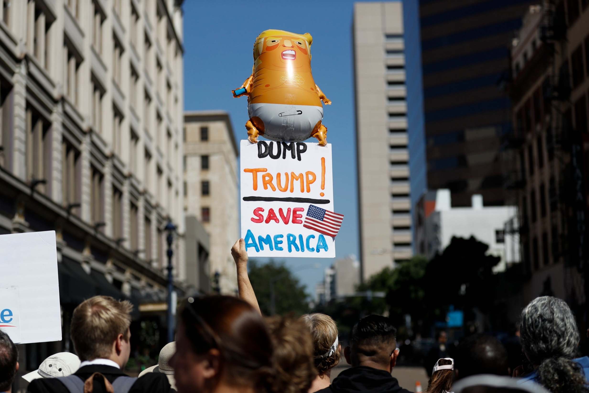 People protest Donald Trump's arrival to a fundraiser in San Diego