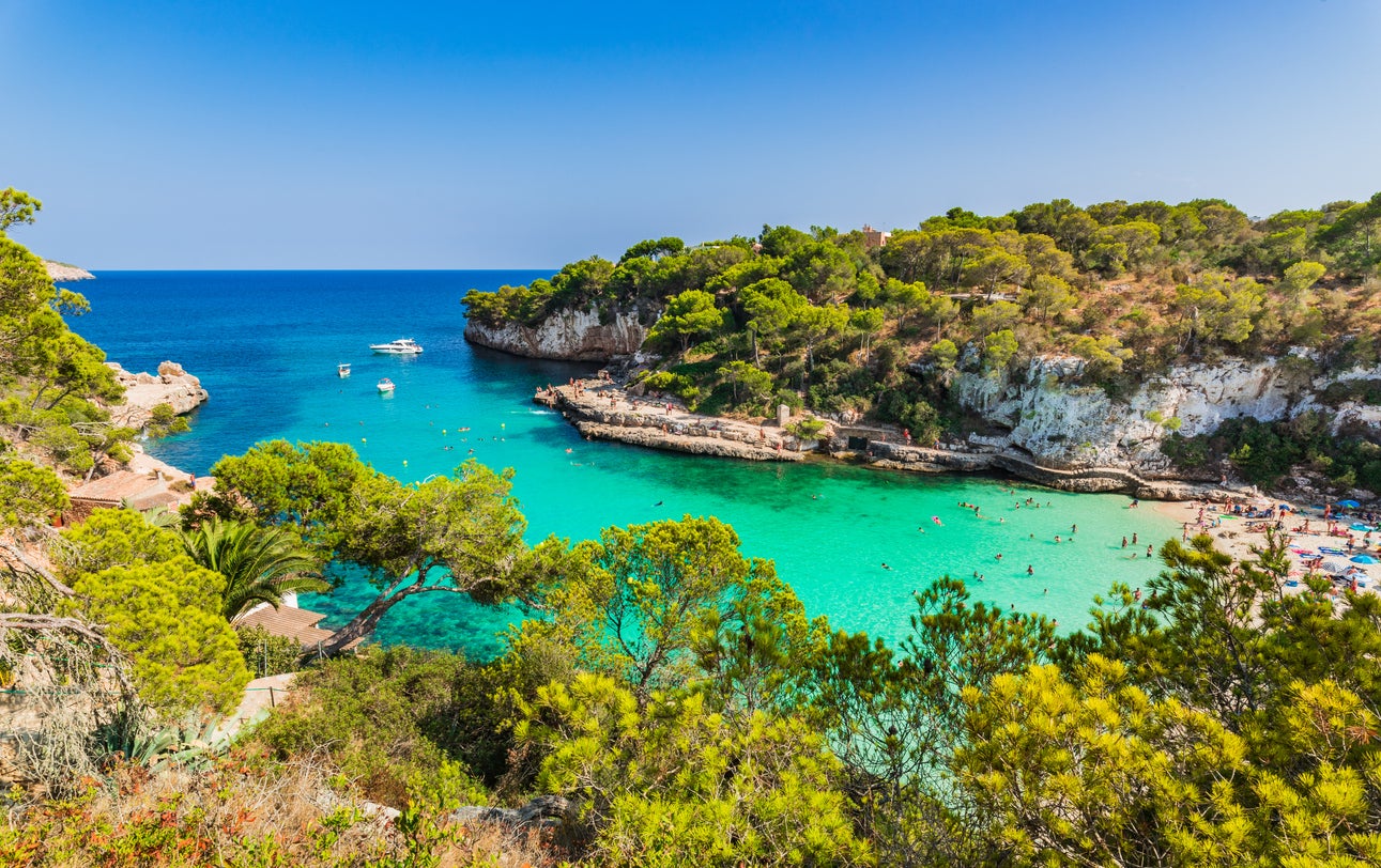 Cala Llombards has green-blue waters