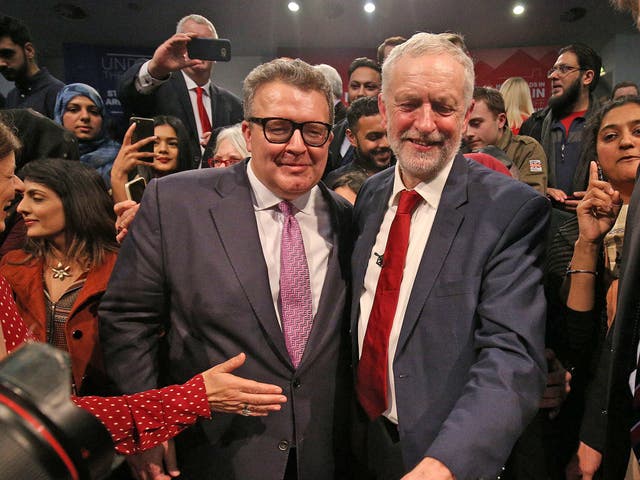 Labour party leader Jeremy Corbyn is congratulated by deputy leader Tom Watson after addressing a post-Budget rally at the Bethel Convention Centre, West Bromwich, in 2017
