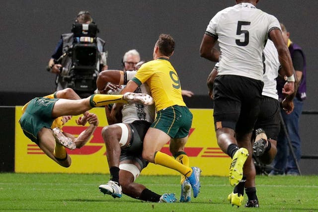 Reece Hodge (left) has been cited for this tackle on Peceli Yato during Australia's victory over Tonga