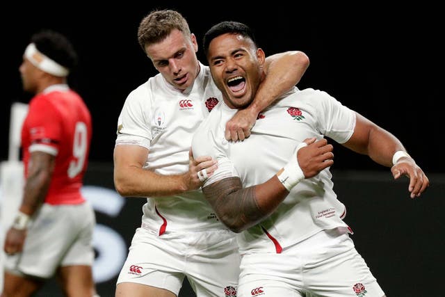 England's Manu Tuilagi is congratulated by teammate George Ford