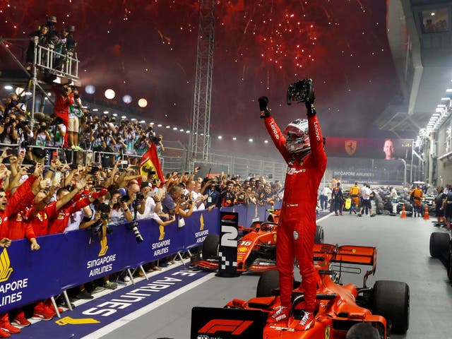 Ferrari's Sebastian Vettel celebrates after winning the race