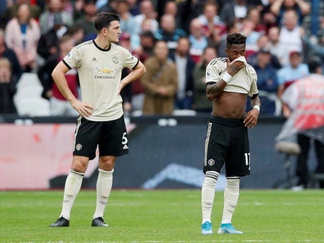 Manchester United's Harry Maguire and Fred look dejected