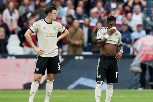Manchester United's Harry Maguire and Fred look dejected