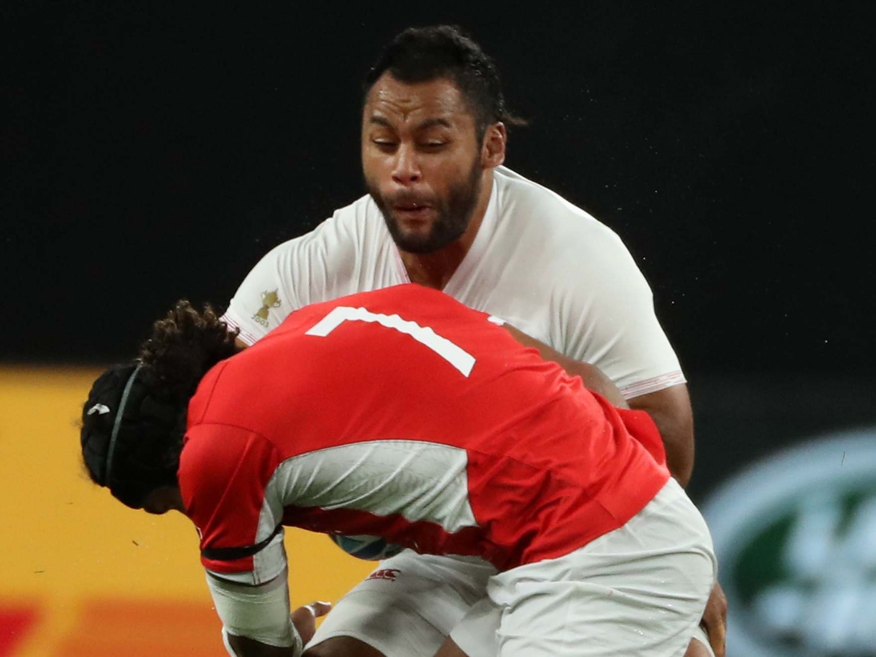 Billy Vunipola was tackled hard by Tonga's Zane Kapeli during England's Rugby World Cup win