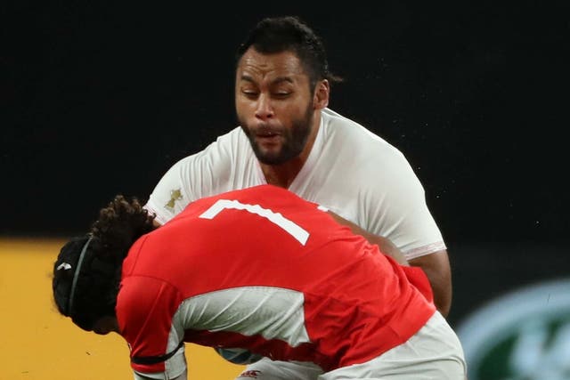 Billy Vunipola was tackled hard by Tonga's Zane Kapeli during England's Rugby World Cup win