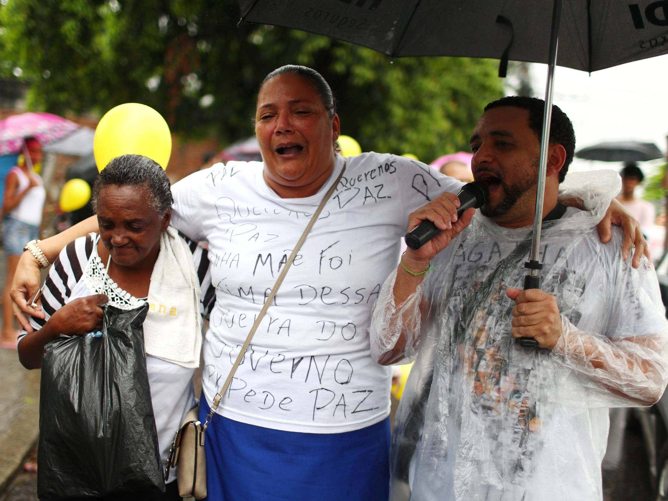 Residents of Complexo do Alemao march in protest over the death of eight -year-old Agatha Felix
