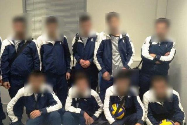 The 10 refugees were wearing matching tracksuits and carrying volleyballs
