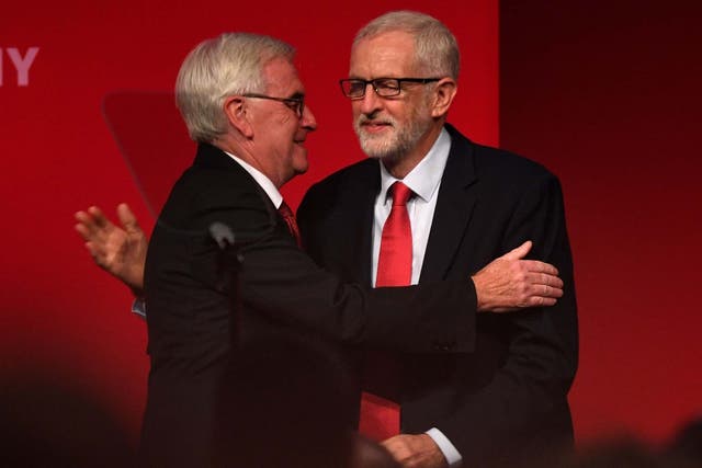 McDonnell is greeted by Corbyn before delivering his speech