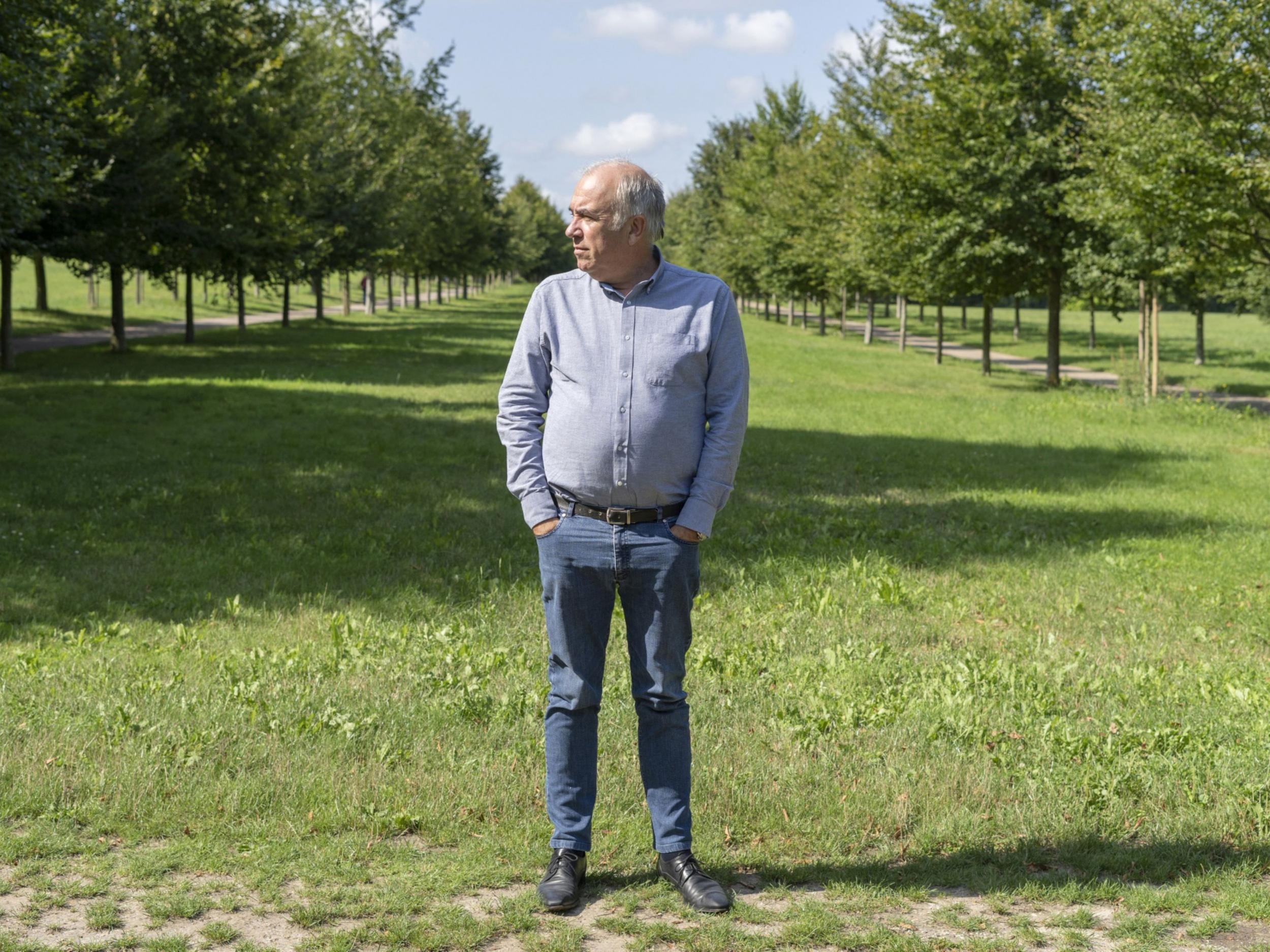 Head gardener Alain Baraton, between rows of trees at Versailles